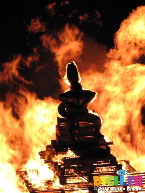 SX16830 Silhouette of guy on top of bonfire